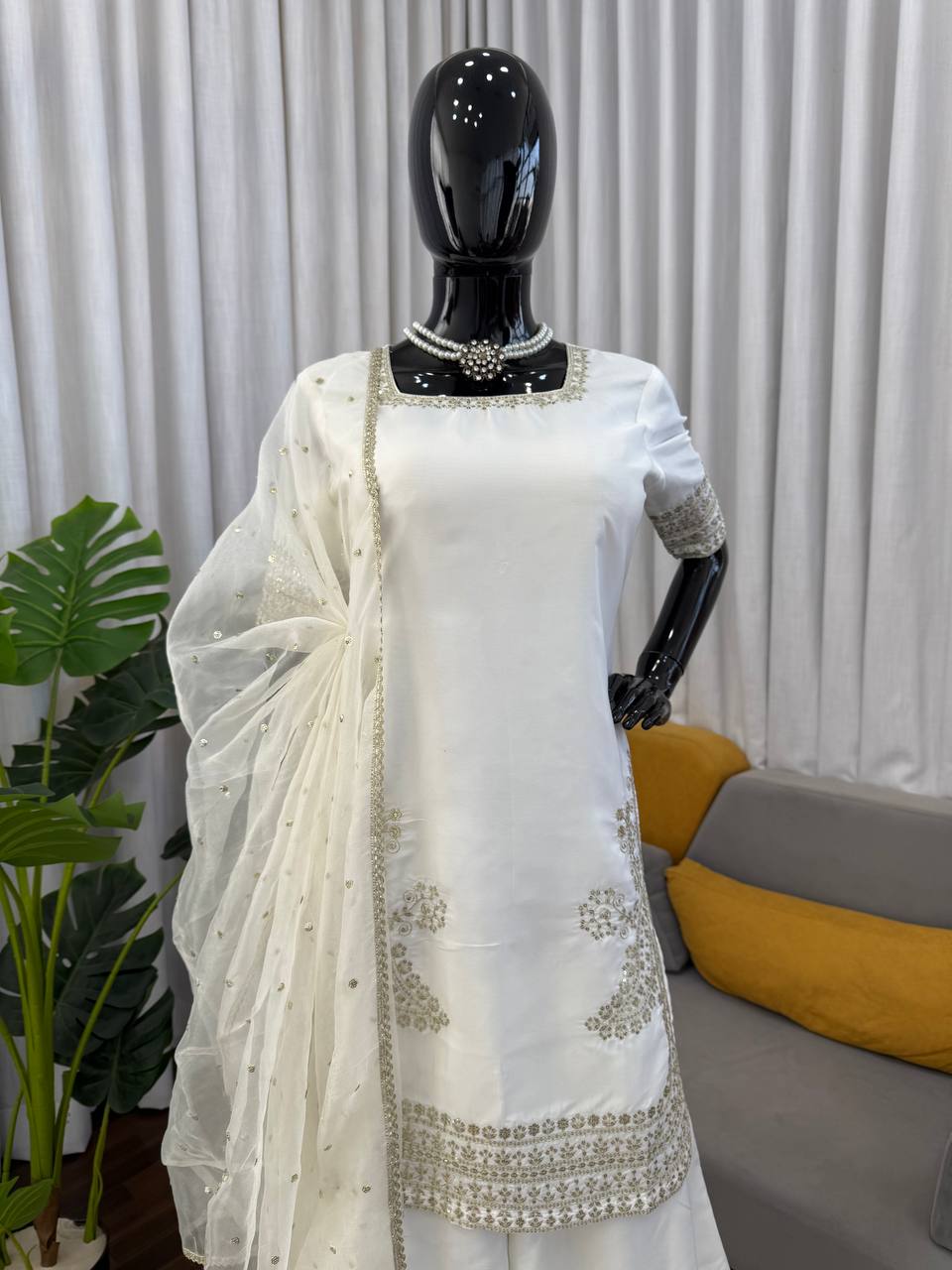 Elegant White Sharara Suit With Golden Embroidery And Net Dupatta