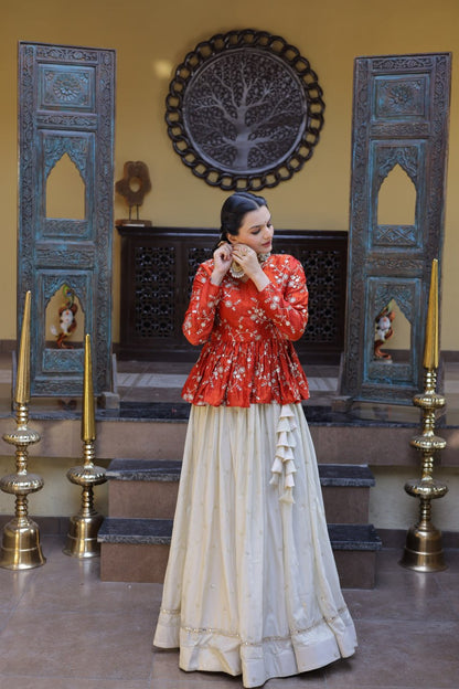 Orange Floral Embroidered Peplum Top With Off-White Lehenga Skirt Set