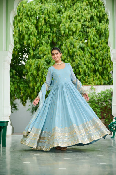 Light Blue Anarkali Gown With Golden Embroidery And Flared Design