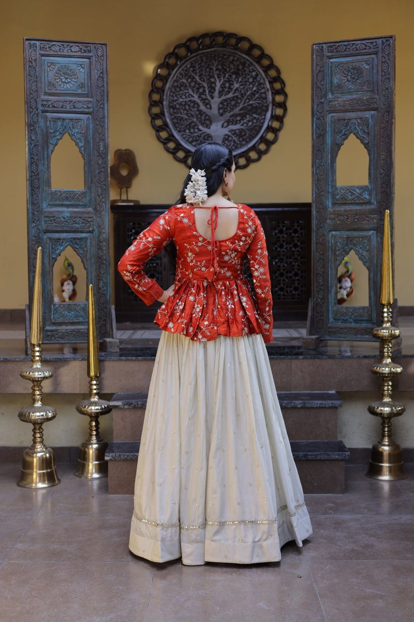 Orange Floral Embroidered Peplum Top With Off-White Lehenga Skirt Set