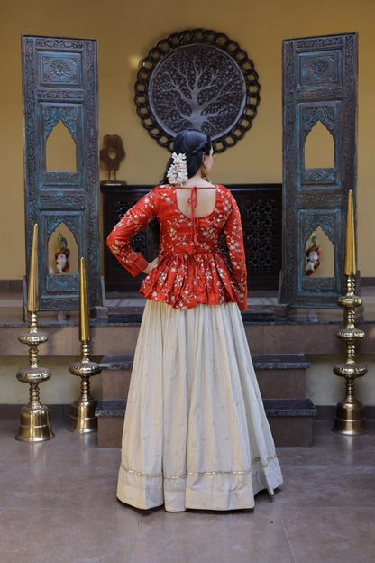 Orange Floral Embroidered Peplum Top With Off-White Lehenga Skirt Set