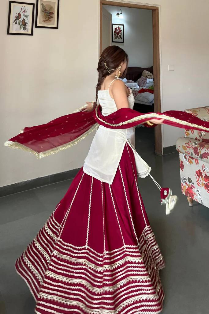 Off White Sleeveless Top And Lehenga With Dupatta