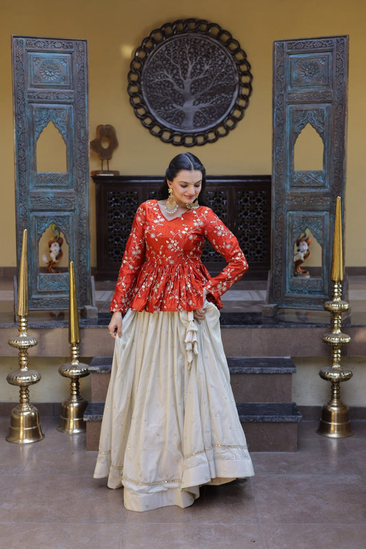 Orange Floral Embroidered Peplum Top With Off-White Lehenga Skirt Set