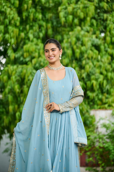 Light Blue Anarkali Gown With Golden Embroidery And Flared Design