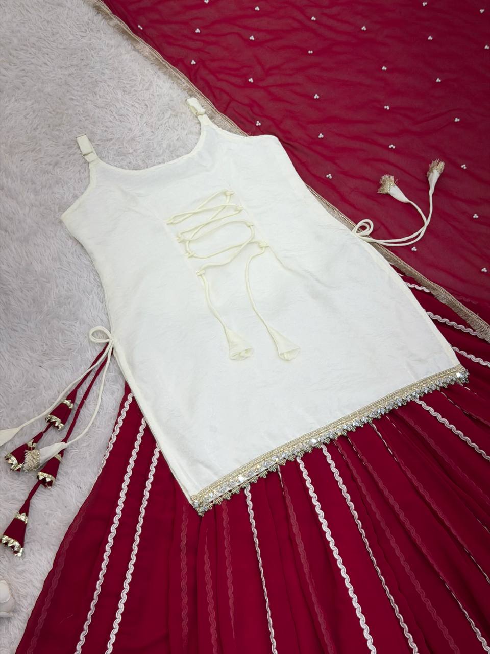 Off White Sleeveless Top And Lehenga With Dupatta