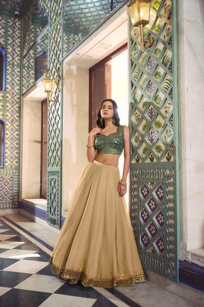 Beige Flared Lehenga Set With Emerald Green Zari Embroidered Blouse And Dupatta