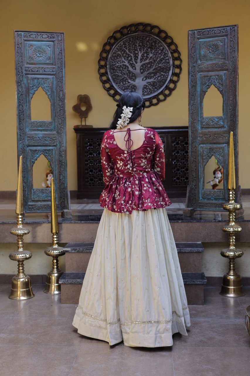 Wine Floral Embroidered Peplum Top With Off-White Lehenga Skirt Set