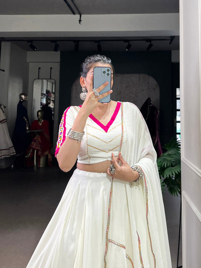 White Lehenga Choli With Golden Zari And Pink Border
