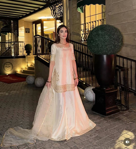 Elegant White Sharara Suit With Golden Embroidery And Net Dupatta