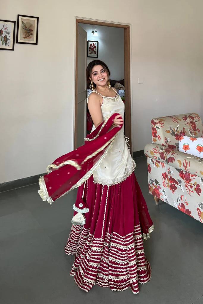Off White Sleeveless Top And Lehenga With Dupatta