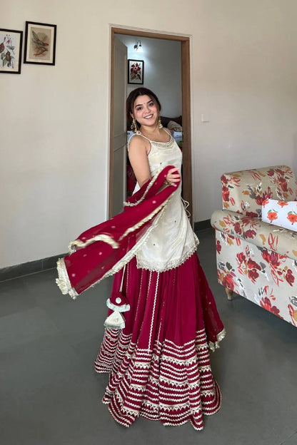 Off White Sleeveless Top And Lehenga With Dupatta