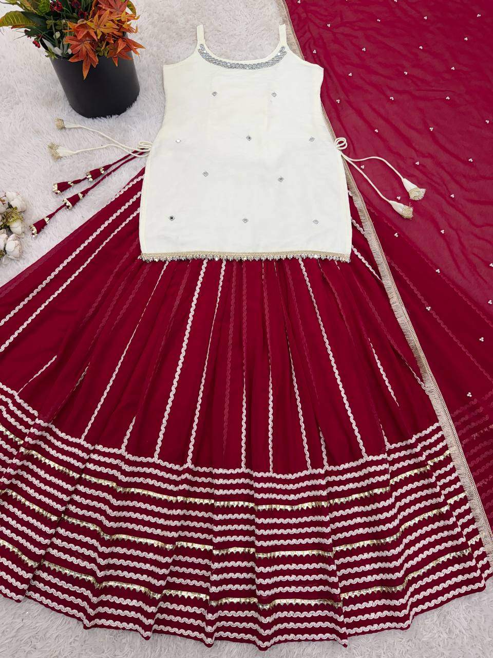 Off White Sleeveless Top And Lehenga With Dupatta