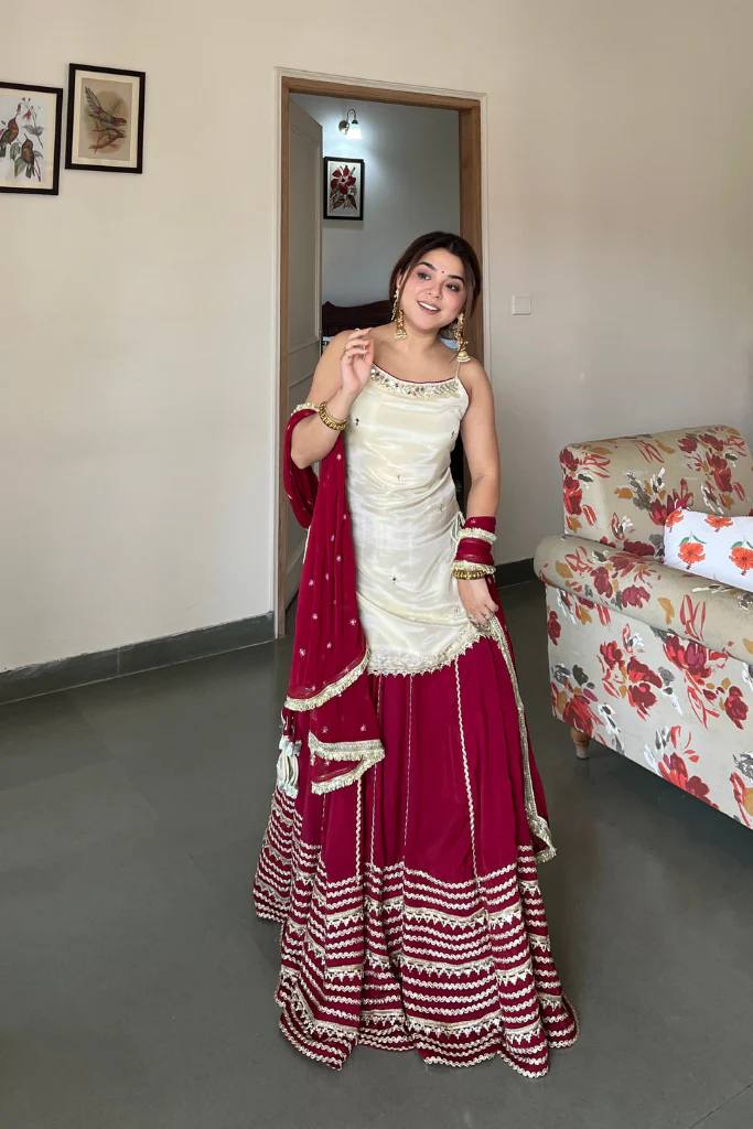 Off White Sleeveless Top And Lehenga With Dupatta