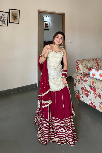 Off White Sleeveless Top And Lehenga With Dupatta