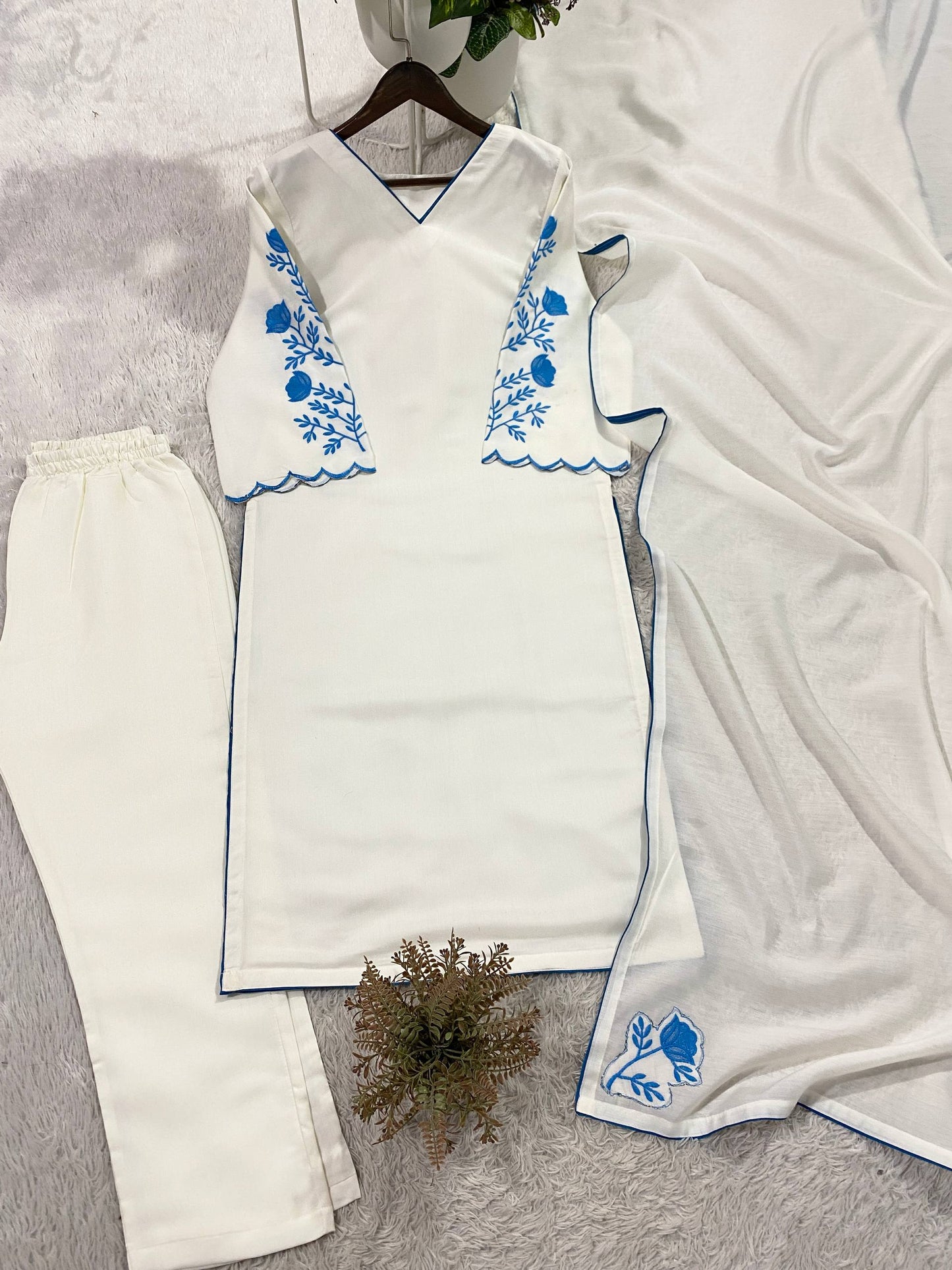Elegant White Roman Silk Kurti With Blue Floral Embroidery On Sleeves And Matching Dupatta