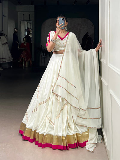 White Lehenga Choli With Golden Zari And Pink Border