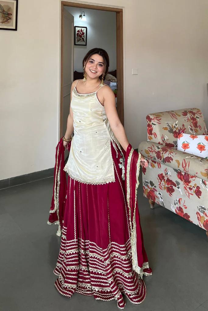 Off White Sleeveless Top And Lehenga With Dupatta