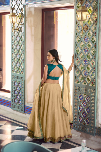 Beige Flared Lehenga Set With Emerald Green Zari Embroidered Blouse And Dupatta