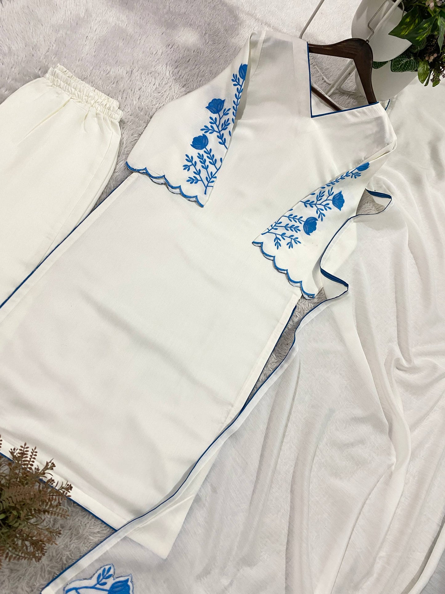 Elegant White Roman Silk Kurti With Blue Floral Embroidery On Sleeves And Matching Dupatta