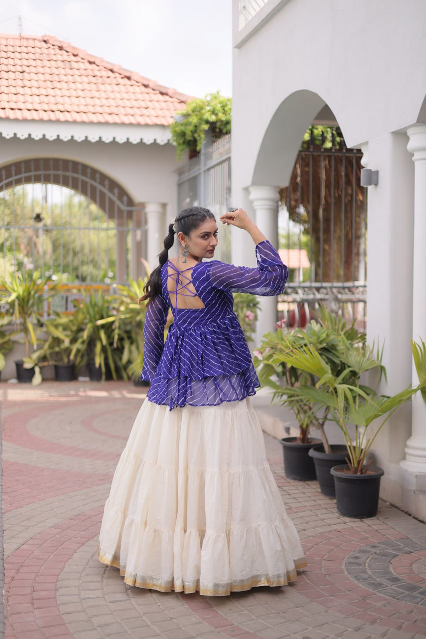 12 Meter Layered Flared Lehenga Choli With Kutchi Mirror Work And Leheriya Ruffle Top